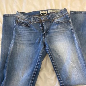 indigo rein jeans with small distressed spots